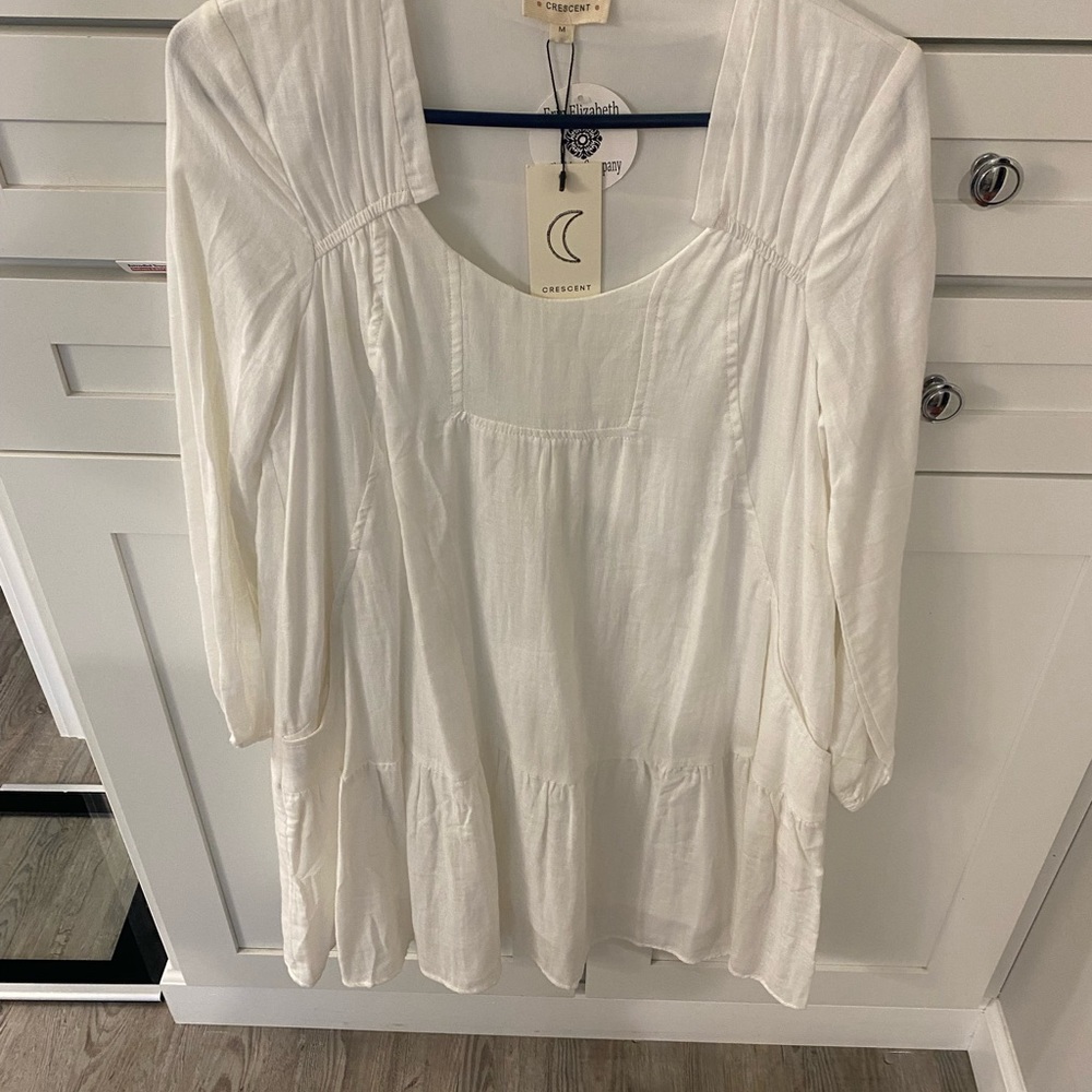White long sleeved women’s dress
